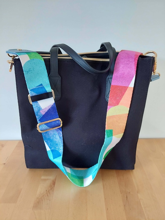 Photograph of the crossbody tote with harmony colorful strap